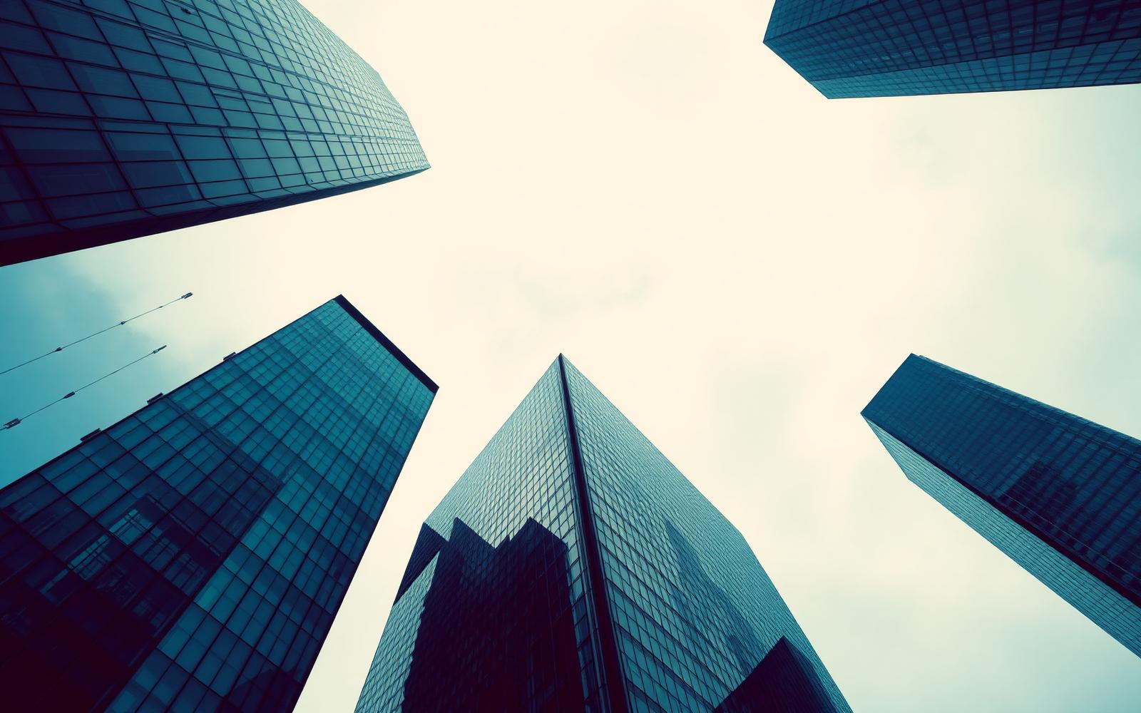 Modern corporate towers viewed from below